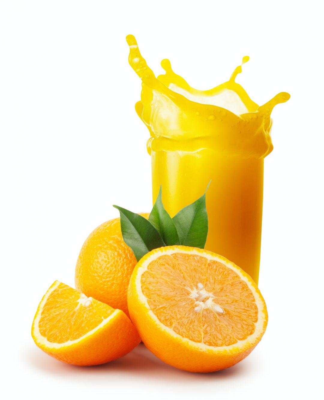 Splash of orange juice and oranges with leaves